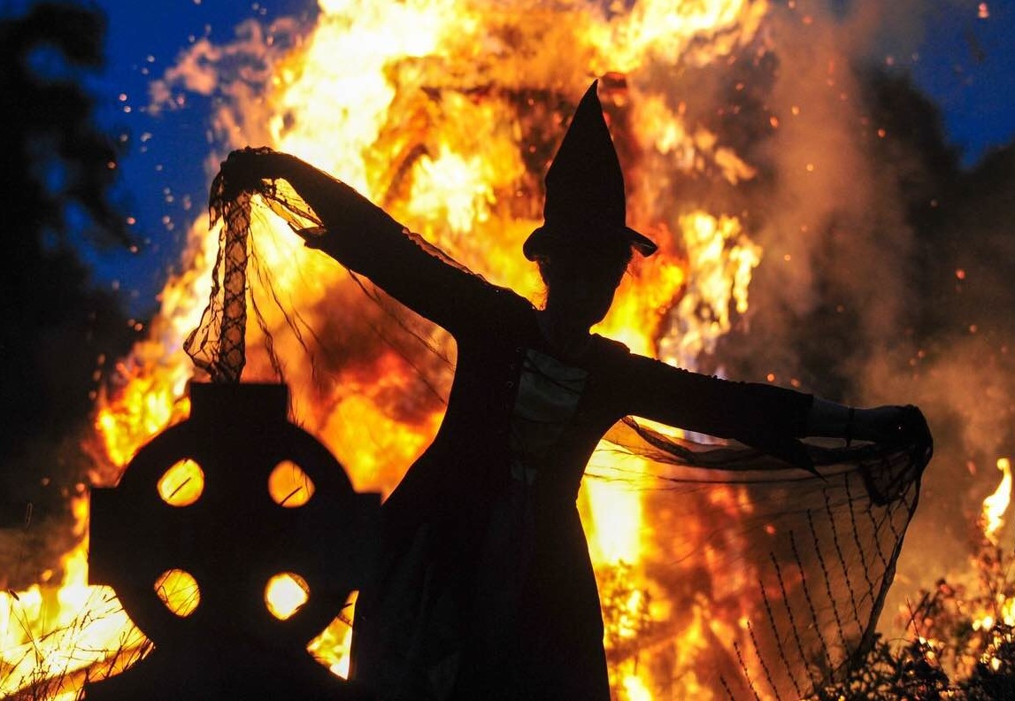 Witch dancing infront of a fire